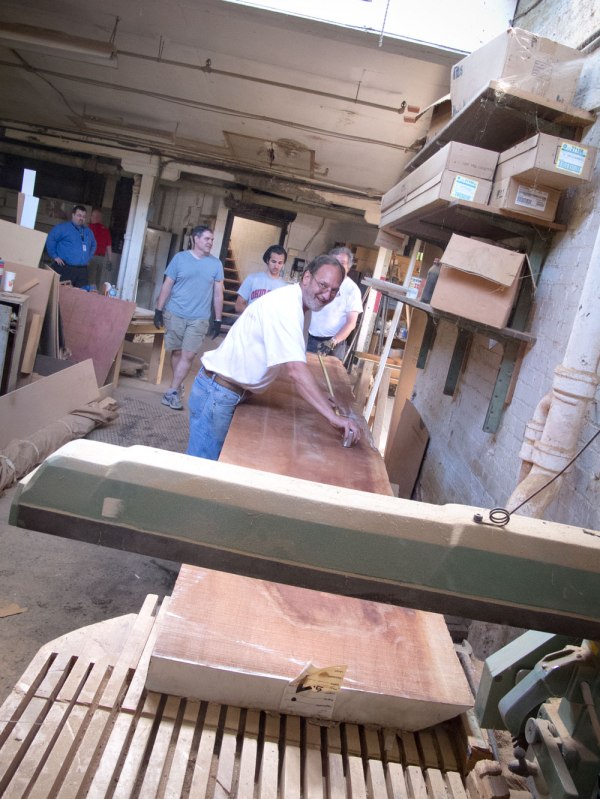 Daryl of Midwest attempts to cut a Sipo plank on a radial arm so. No dice.