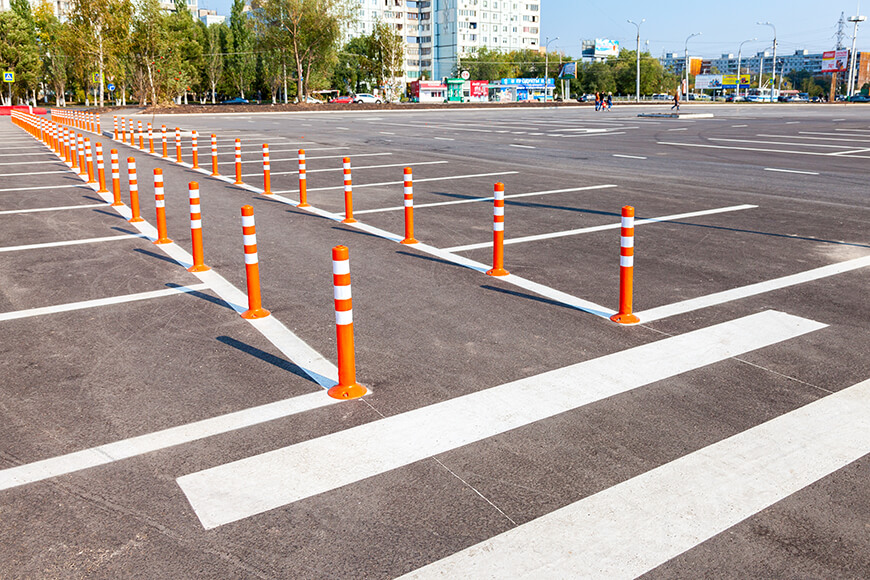 reflective flexible bollards in a parking lot