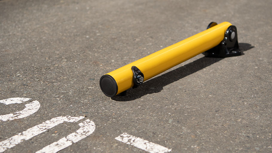 Reliance Foundry folding bollard in a parking lot.