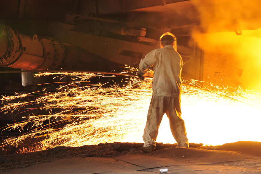 Foundry melter injecting oxygen into steel furnace bath