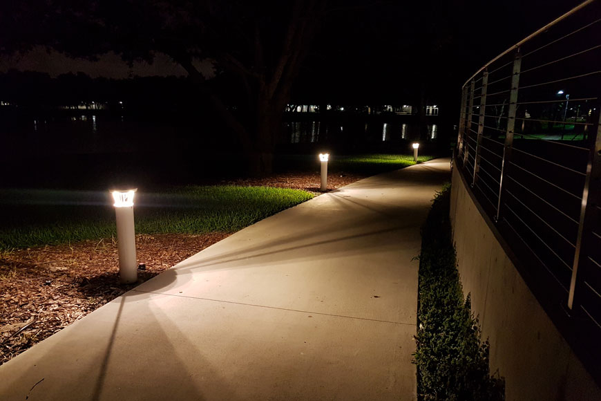 Lighted bollards near water