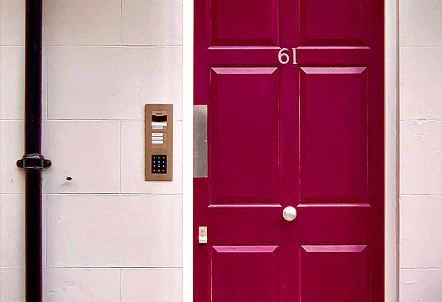 Finger door plate on burgundy door.