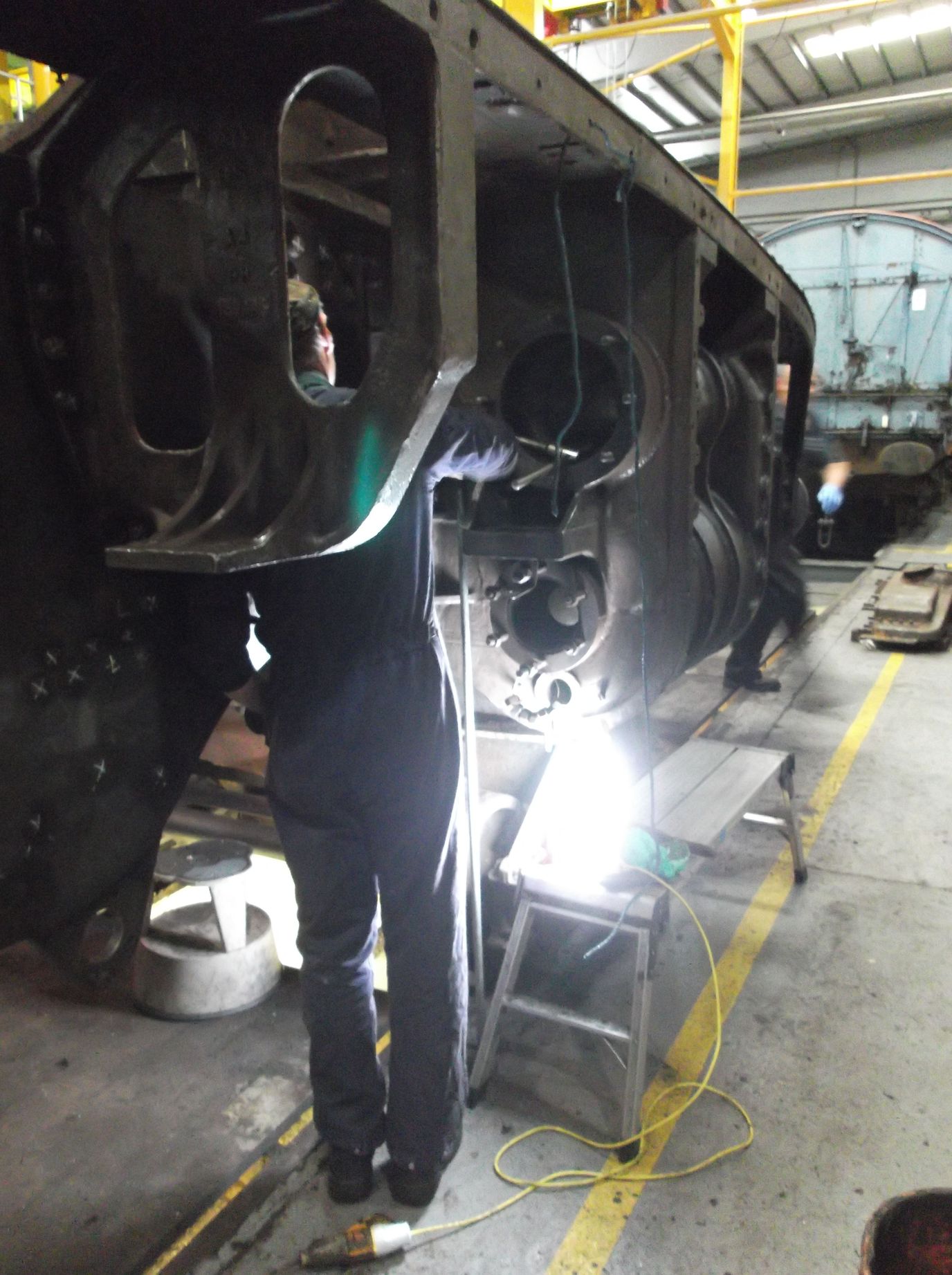 Engineering team volunteer Dave Lee removing a broken stud.