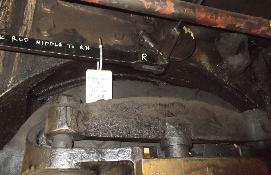 Part of the drain cock mechanism. A view inside the frames looking over the top of the RH trailing bogie wheel axlebox. The pulley is moved by operating a lever on the fireman's side of the cab connected by a steel cable. The pulley shaft operates a lever and rod to the centre cylinder cocks and is linked to another shaft that operates the outside cylinder cocks.