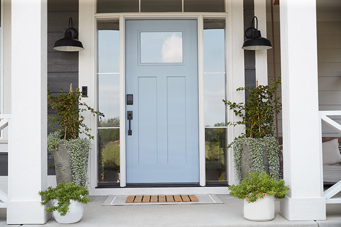 Sky blue crafstmand front door with a Schlage Encode smart wifi deadbolt.