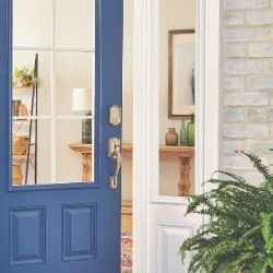 Schlage Encode smart wifi deadbolt in satin nickel with camelot trim on blue front door